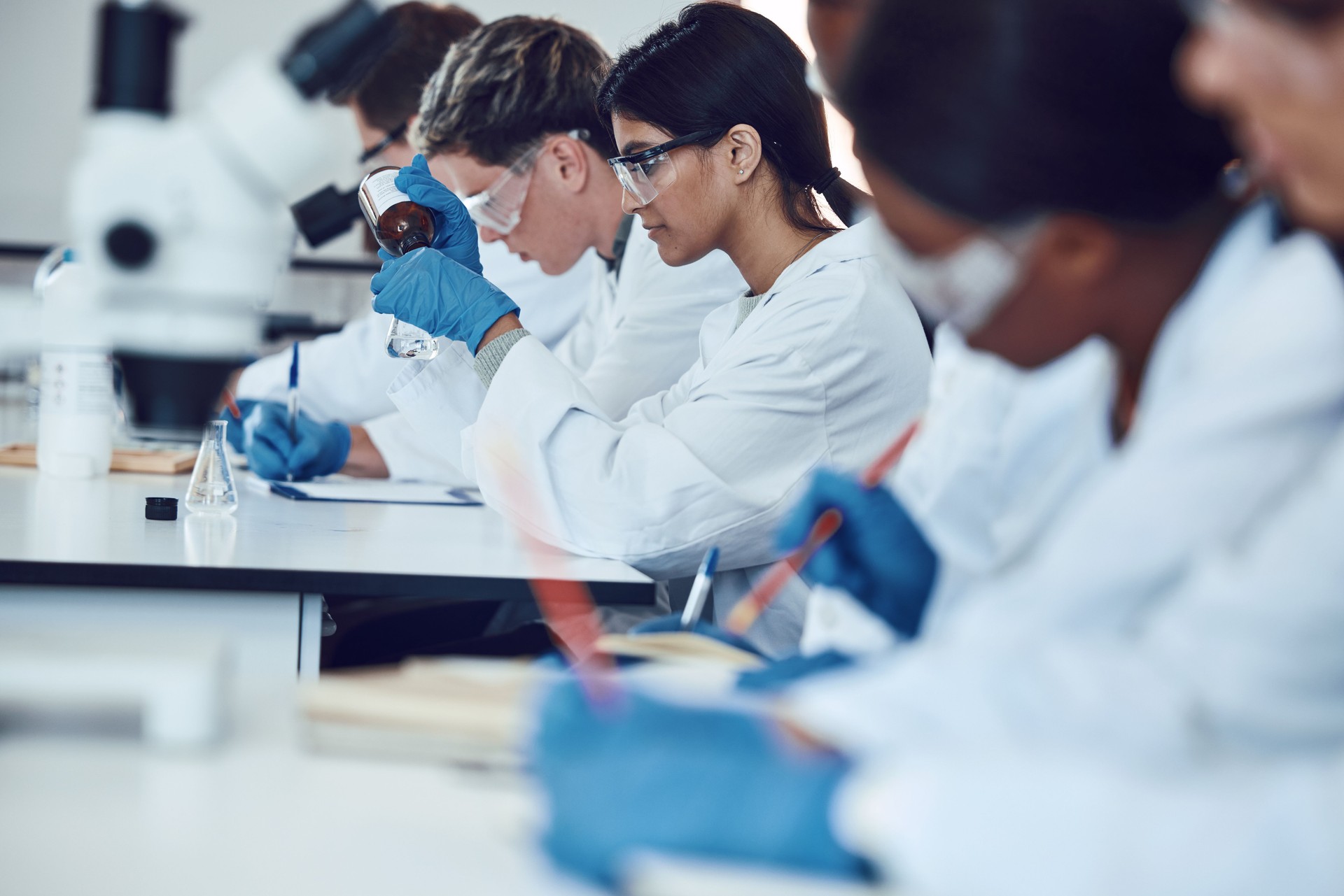 Science, education with students in lab for experiment, learning to be scientist and university with innovation. Teaching, learn and focus with scholarship, research and study for scientific phd.